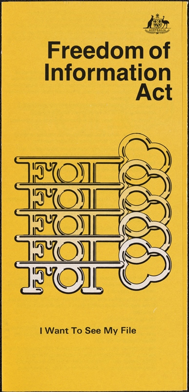 The front cover of a yellow pamphlet. It has a picture of 5 decorative keys where the notches spell ‘FOI’ and the words ‘I want to see my file’ printed below.