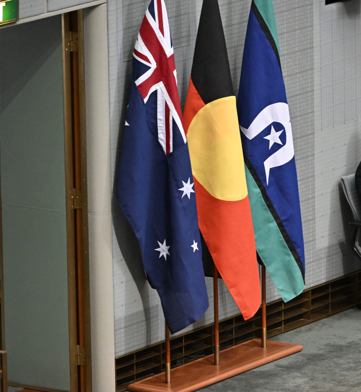 The Australian, Aboriginal and Torres Strait Islander flags fly in the House of Representatives