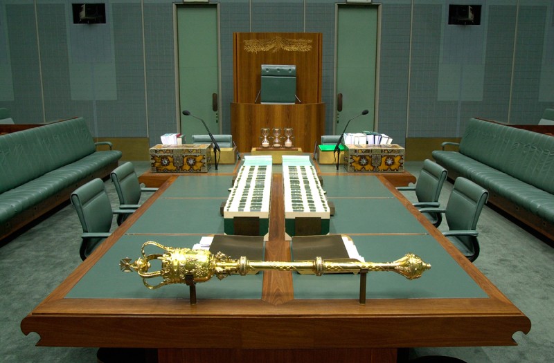 The Mace on brackets on the central table in the green House of Representatives.